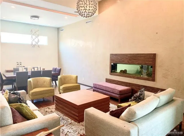 a kitchen with stainless steel appliances granite countertop sink refrigerator and window