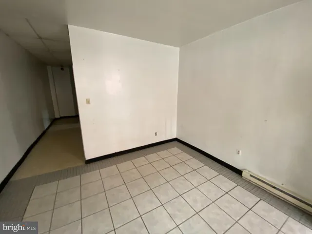 a view of a room with white walls