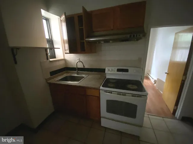 a kitchen with a stove and a microwave