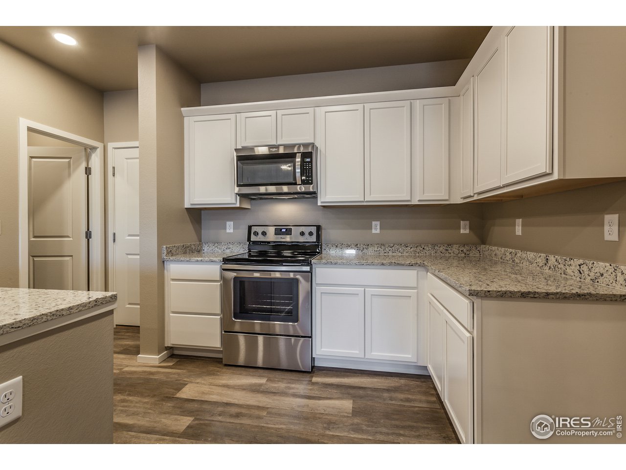 6609 4th St Road, Unit 3 Greeley, CO 80634 - Photo 7 of 28 EXAMPLE PHOTO: KITCHEN W/ S.S. APPLIANCES