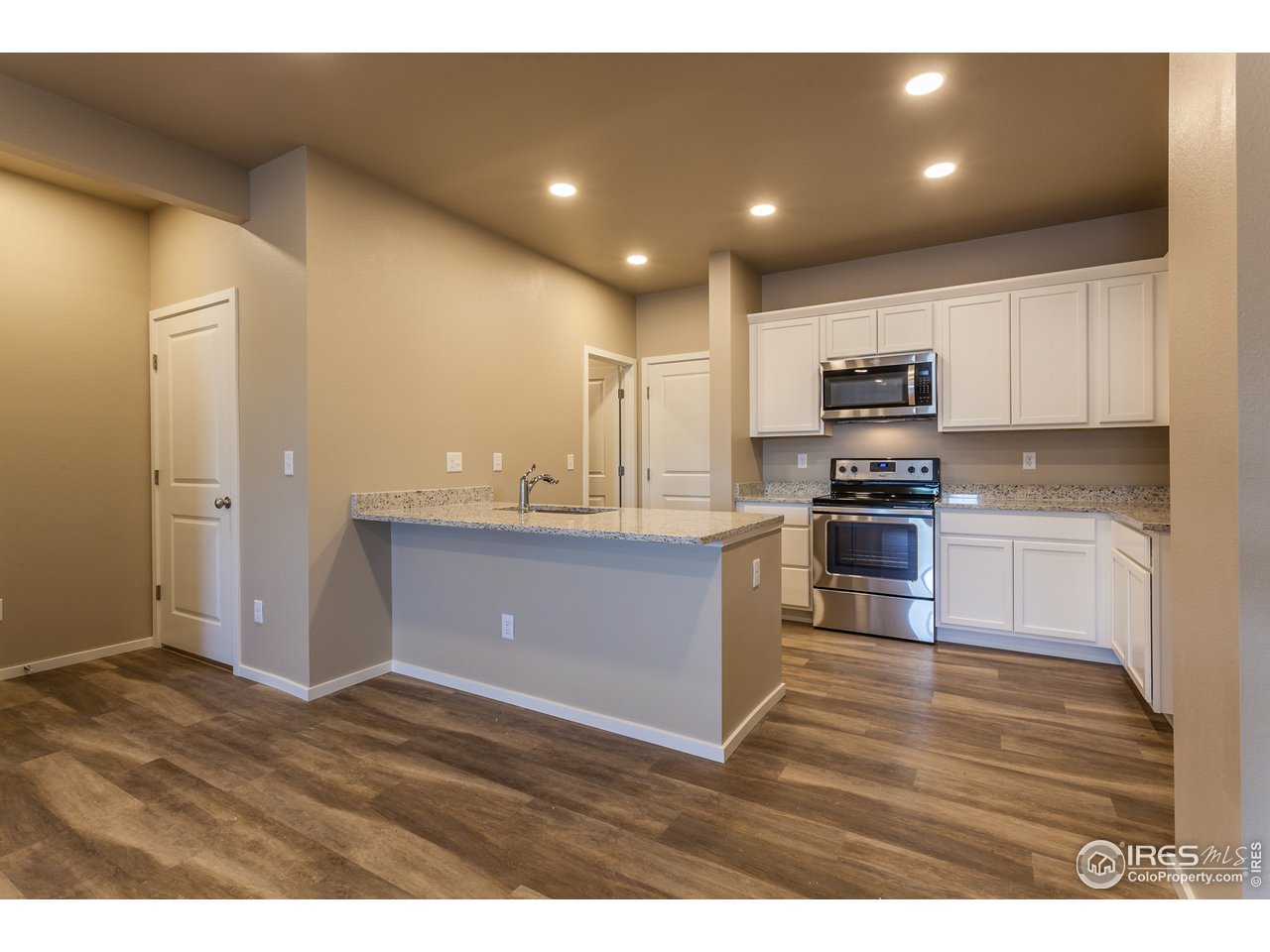 6609 4th St Road, Unit 3 Greeley, CO 80634 - Photo 6 of 28 EXAMPLE PHOTO: KITCHEN W/ ISLAND