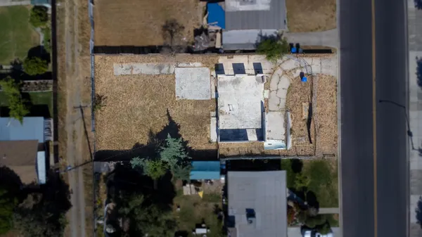 an aerial view of residential house with outdoor space
