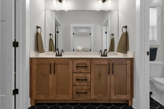 a bathroom with a toilet and shower