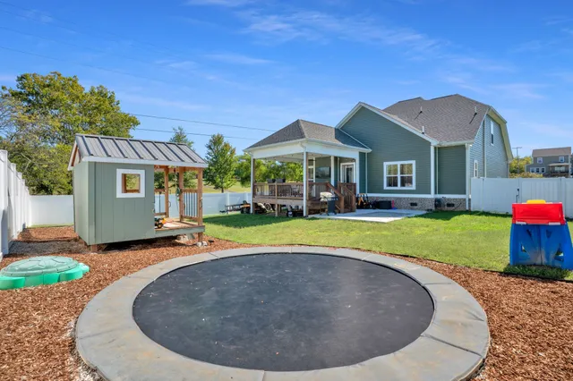 a house view with a sitting space and garden