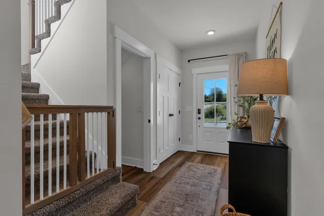 a view of hallway with wooden floor