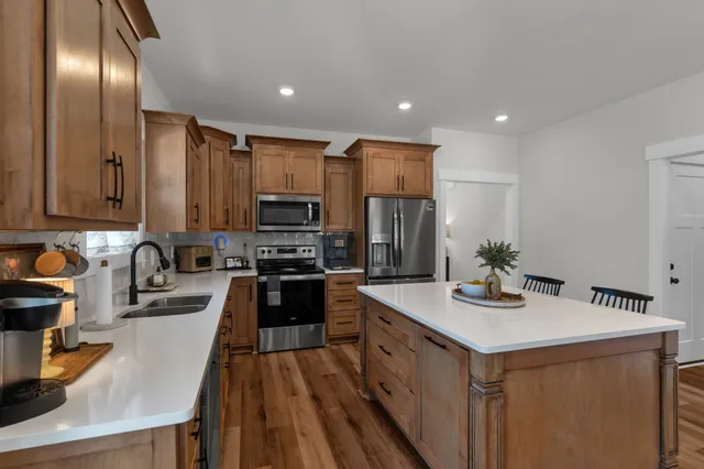 a view of a livingroom with furniture window and wooden floor