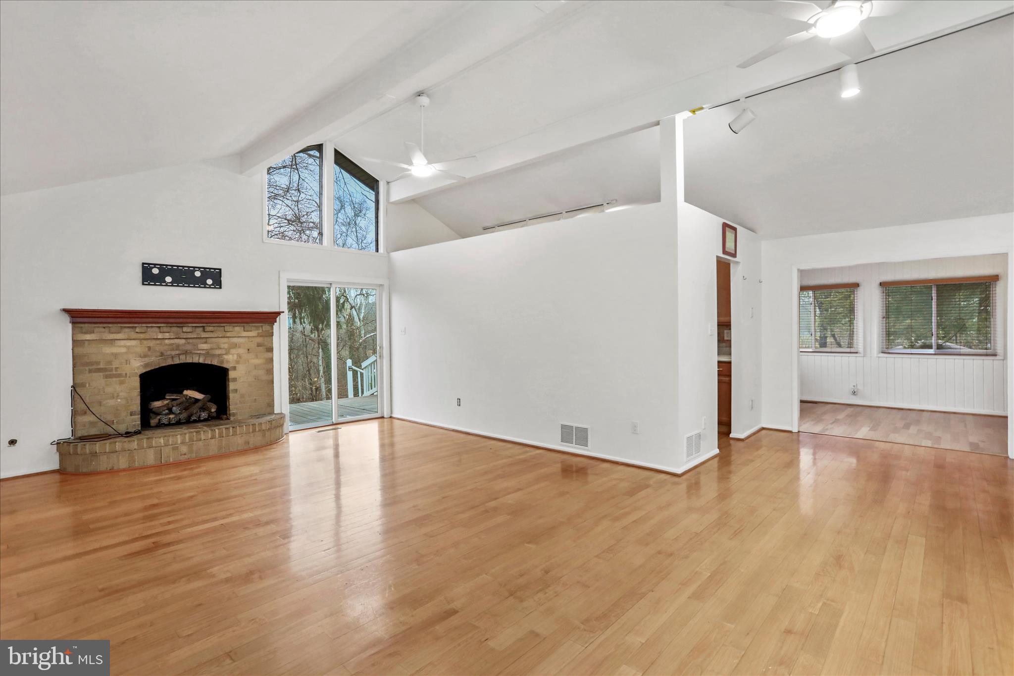 565 South River Road Front Royal, VA 22630 - Photo 11 of 68 a view of a livingroom with wooden floor and a fireplace