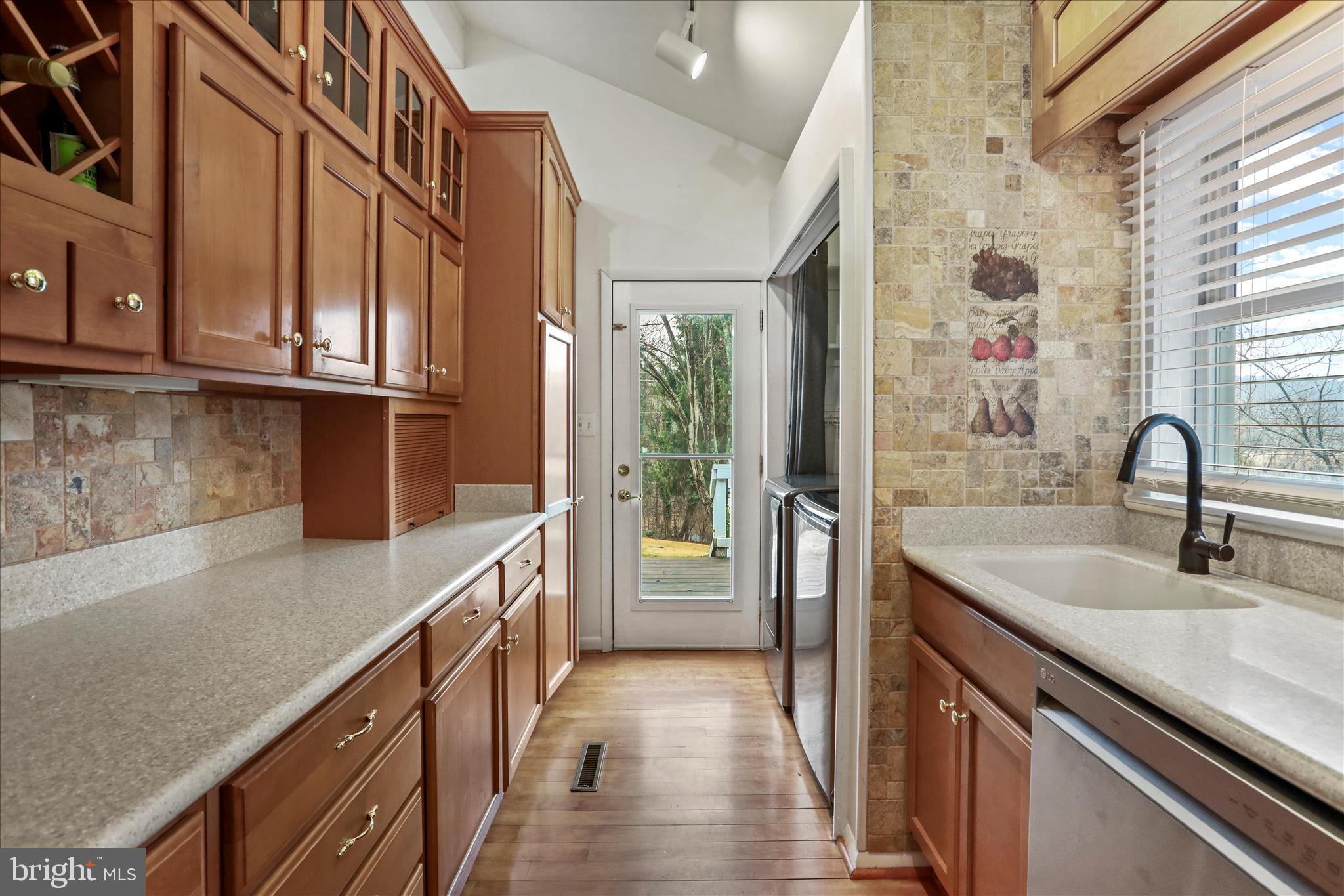 565 South River Road Front Royal, VA 22630 - Photo 16 of 68 a kitchen with a sink and a refrigerator