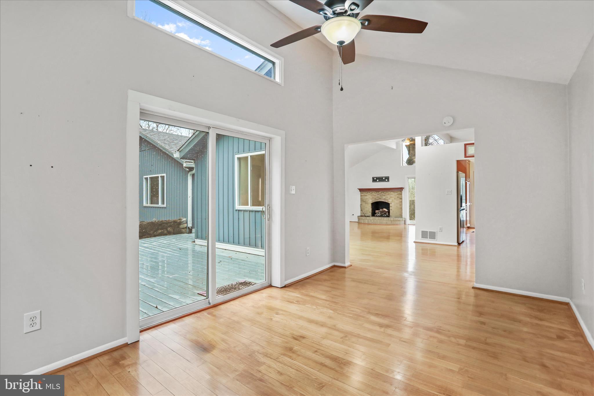 565 South River Road Front Royal, VA 22630 - Photo 18 of 68 an empty room with wooden floor fan and windows