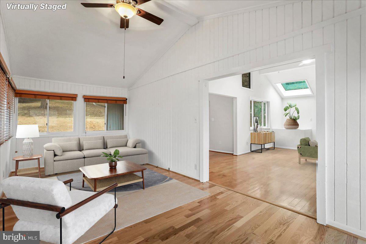 565 South River Road Front Royal, VA 22630 - Photo 21 of 68 a living room with furniture and a chandelier