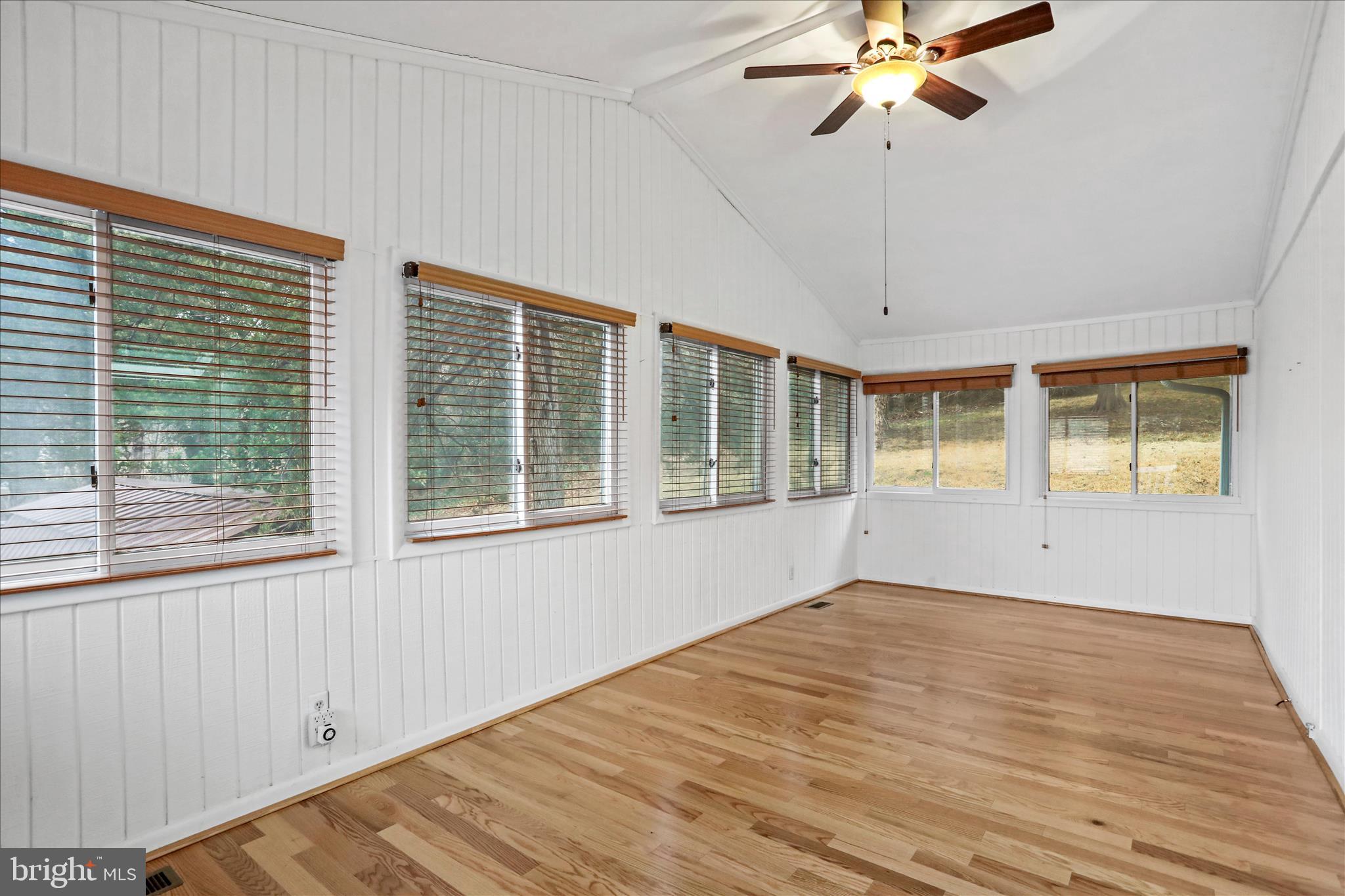 565 South River Road Front Royal, VA 22630 - Photo 23 of 68 a view of an empty room with a window and wooden floor