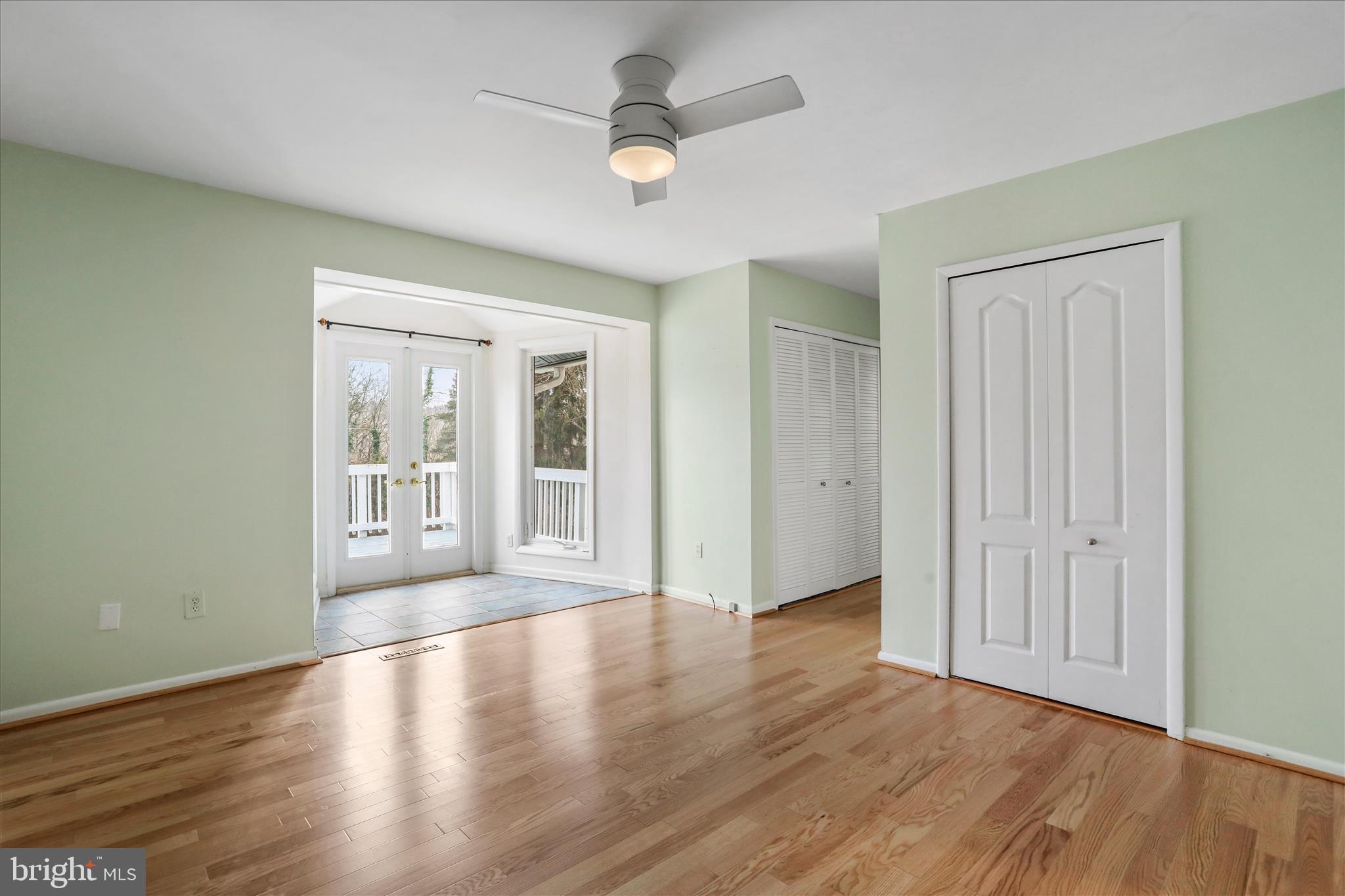 565 South River Road Front Royal, VA 22630 - Photo 32 of 68 an empty room with wooden floor and windows