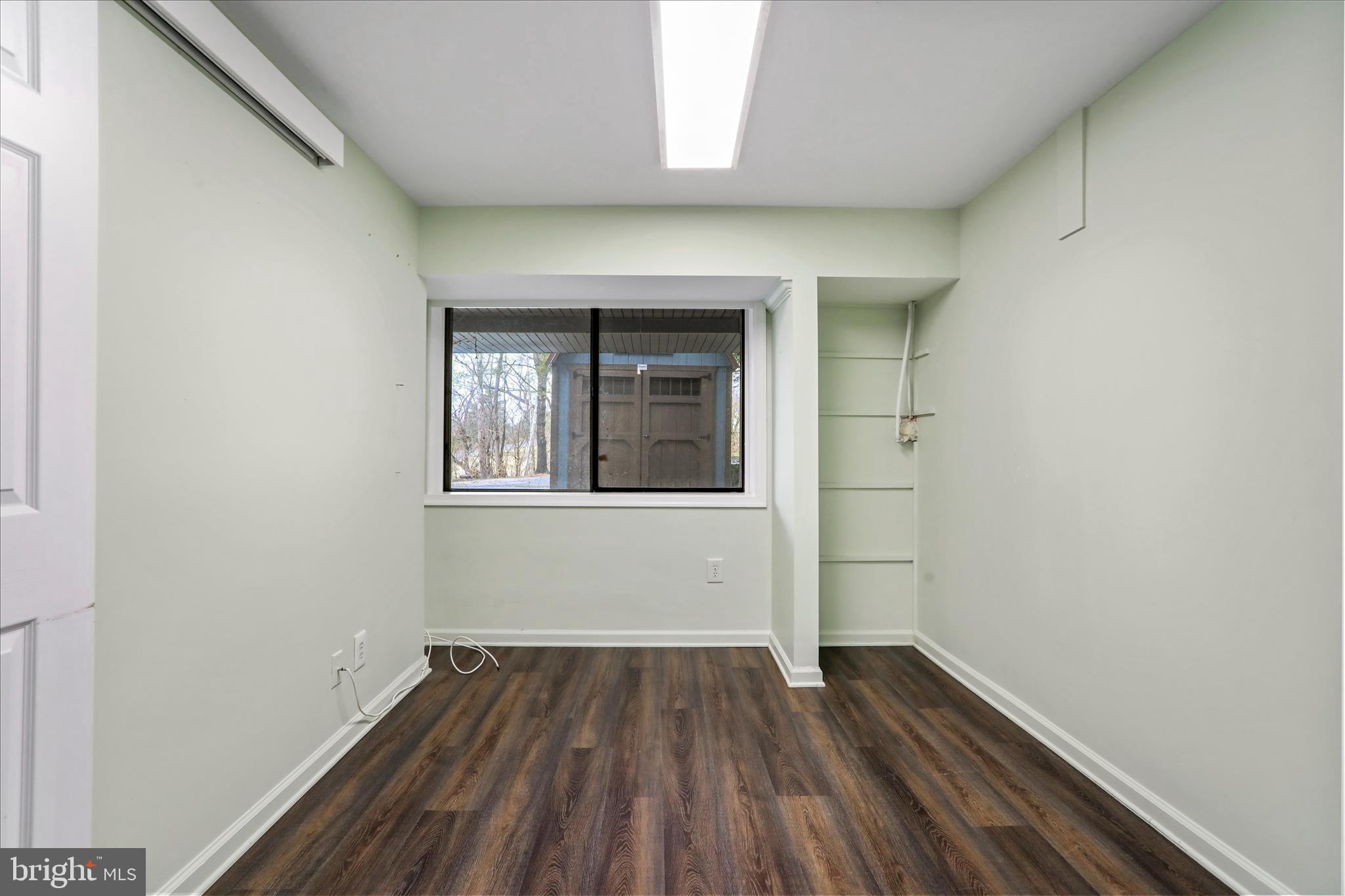 565 South River Road Front Royal, VA 22630 - Photo 40 of 68 a view of an empty room with wooden floor and a window