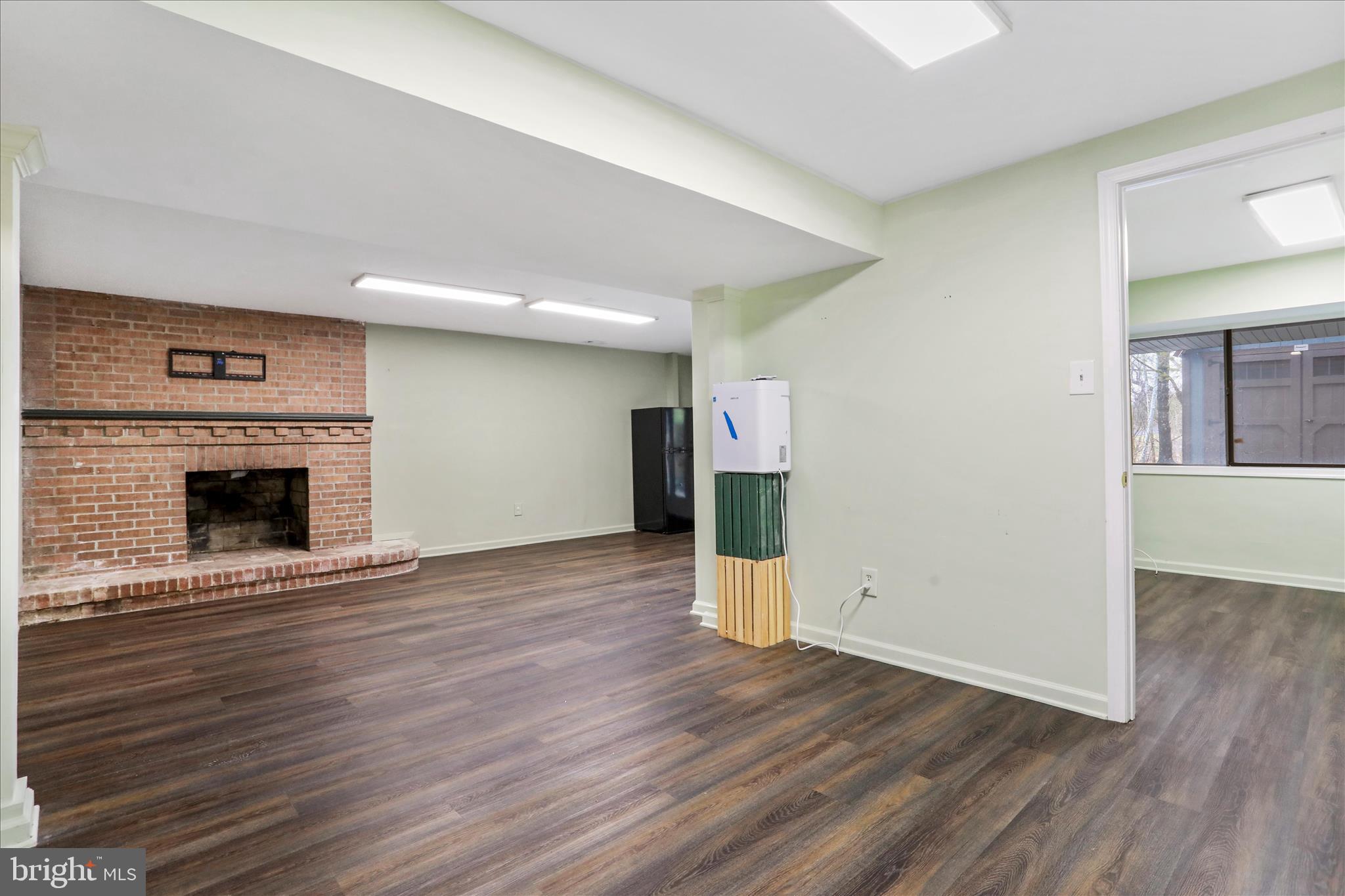 565 South River Road Front Royal, VA 22630 - Photo 42 of 68 a view of empty room with wooden floor and fireplace
