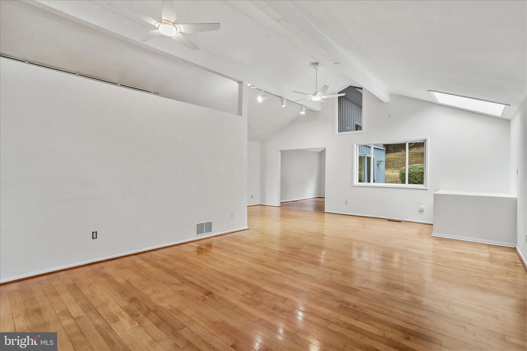 565 South River Road Front Royal, VA 22630 - Photo 9 of 68 an empty room with wooden floor and windows
