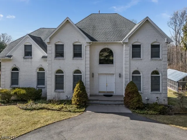a aerial view of a house with a yard
