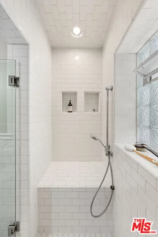 a bathroom with a shower and a bathtub