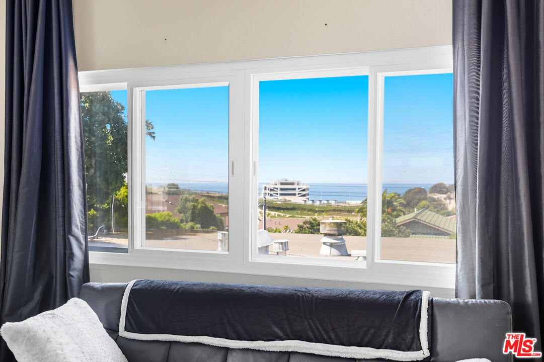 804 Hillcrest Street El Segundo, CA 90245 - Photo 19 of 34 a bedroom with a bed and glass window