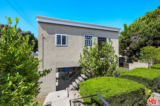 a house that has a lot of plants in it