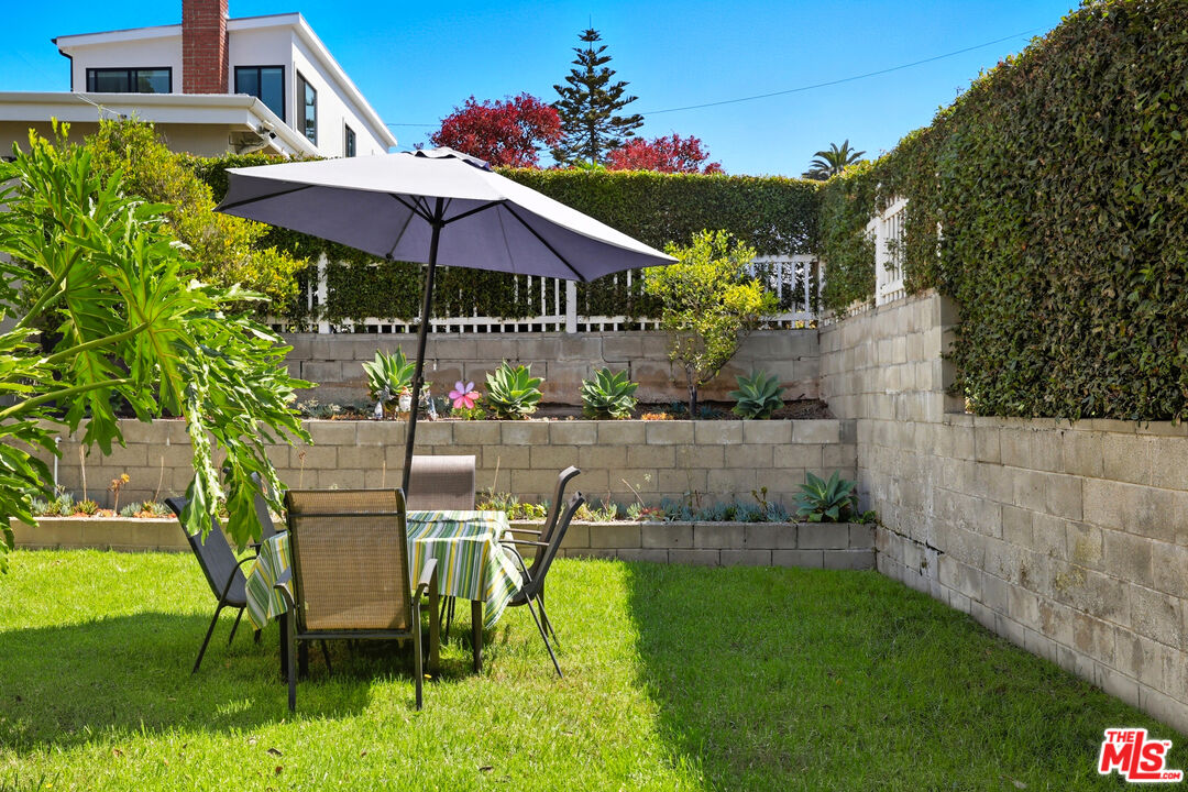 804 Hillcrest Street El Segundo, CA 90245 - Photo 27 of 34 an outdoor space with furniture and umbrella