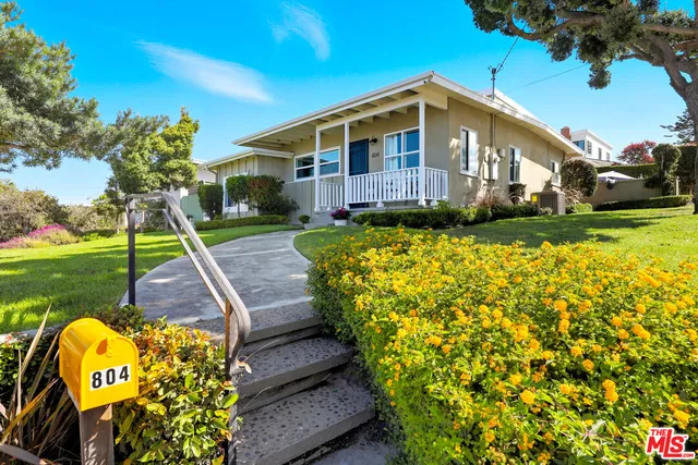 a front view of a house with swimming pool