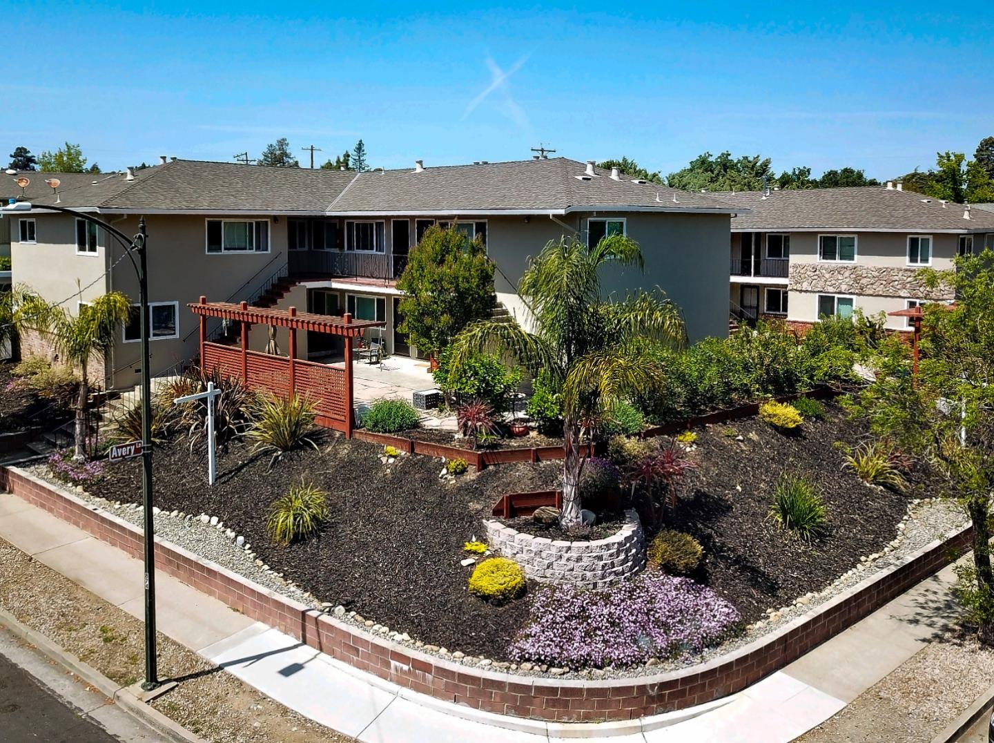 115 Towne Terrace Los Gatos, CA 95032 - Photo 1 of 16 a view of a house with backyard outdoor seating area and fire pit