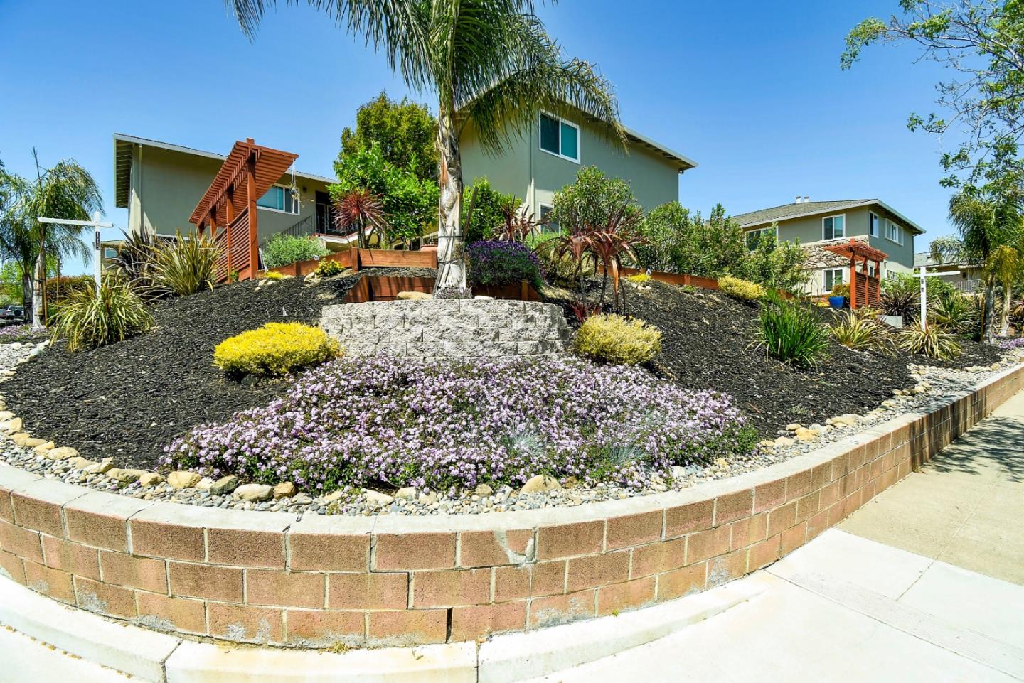 115 Towne Terrace Los Gatos, CA 95032 - Photo 2 of 16 a view of a house with a backyard and plants