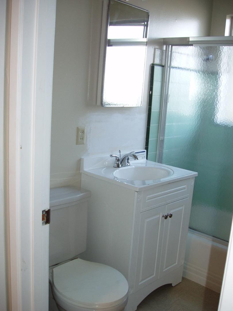 115 Towne Terrace Los Gatos, CA 95032 - Photo 12 of 16 a bathroom with a sink a toilet and a mirror
