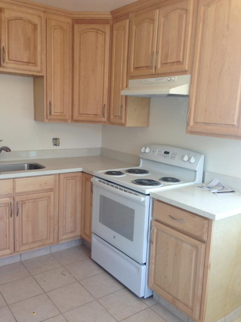 115 Towne Terrace Los Gatos, CA 95032 - Photo 13 of 16 a kitchen with white cabinets and white appliances