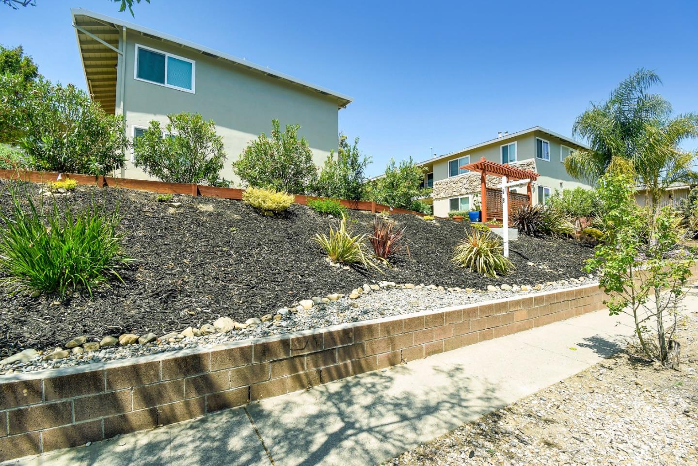 115 Towne Terrace Los Gatos, CA 95032 - Photo 3 of 16 a front view of a house with a yard
