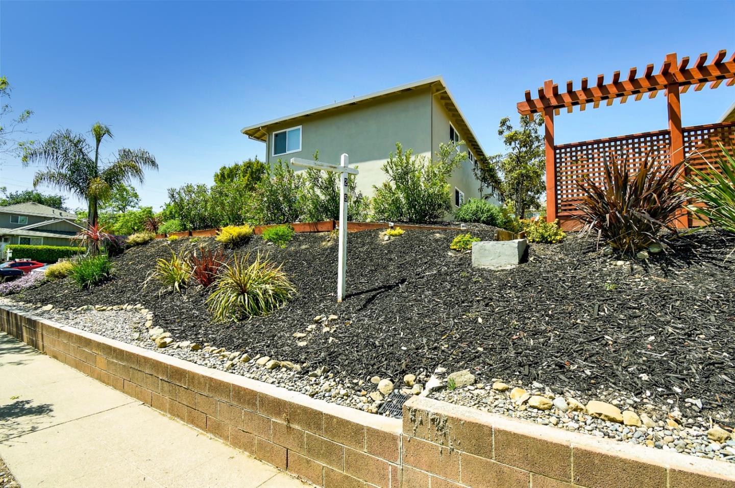 115 Towne Terrace Los Gatos, CA 95032 - Photo 10 of 16 a view of a house with a backyard and sitting area
