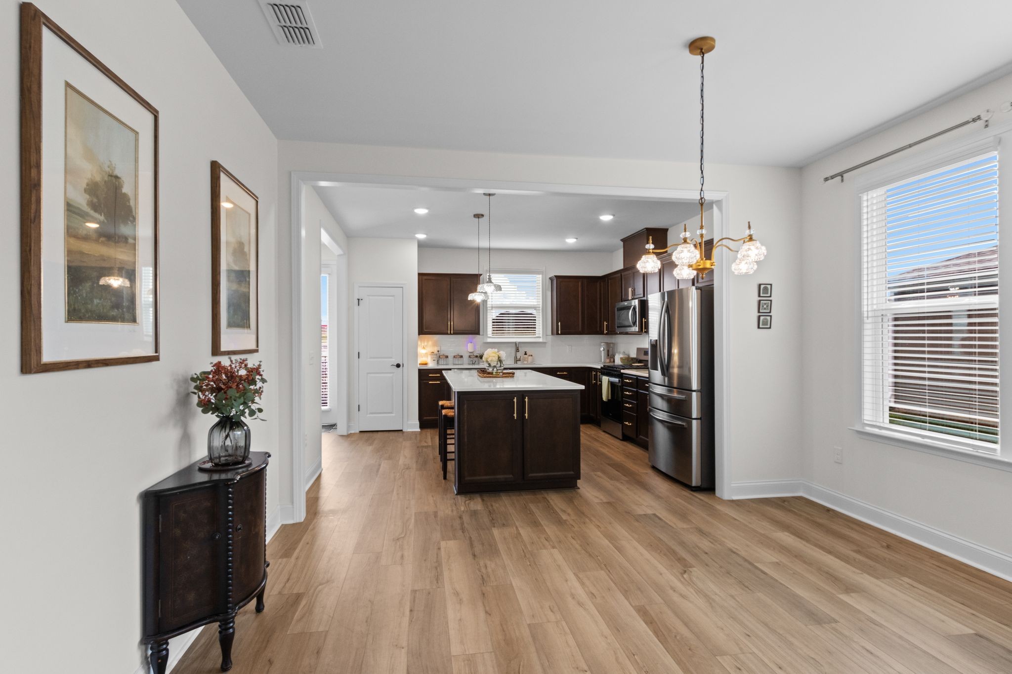 7153 Triad Way Murfreesboro, TN 37128 - Photo 11 of 35 a large kitchen with a table chairs stainless steel appliances and cabinets