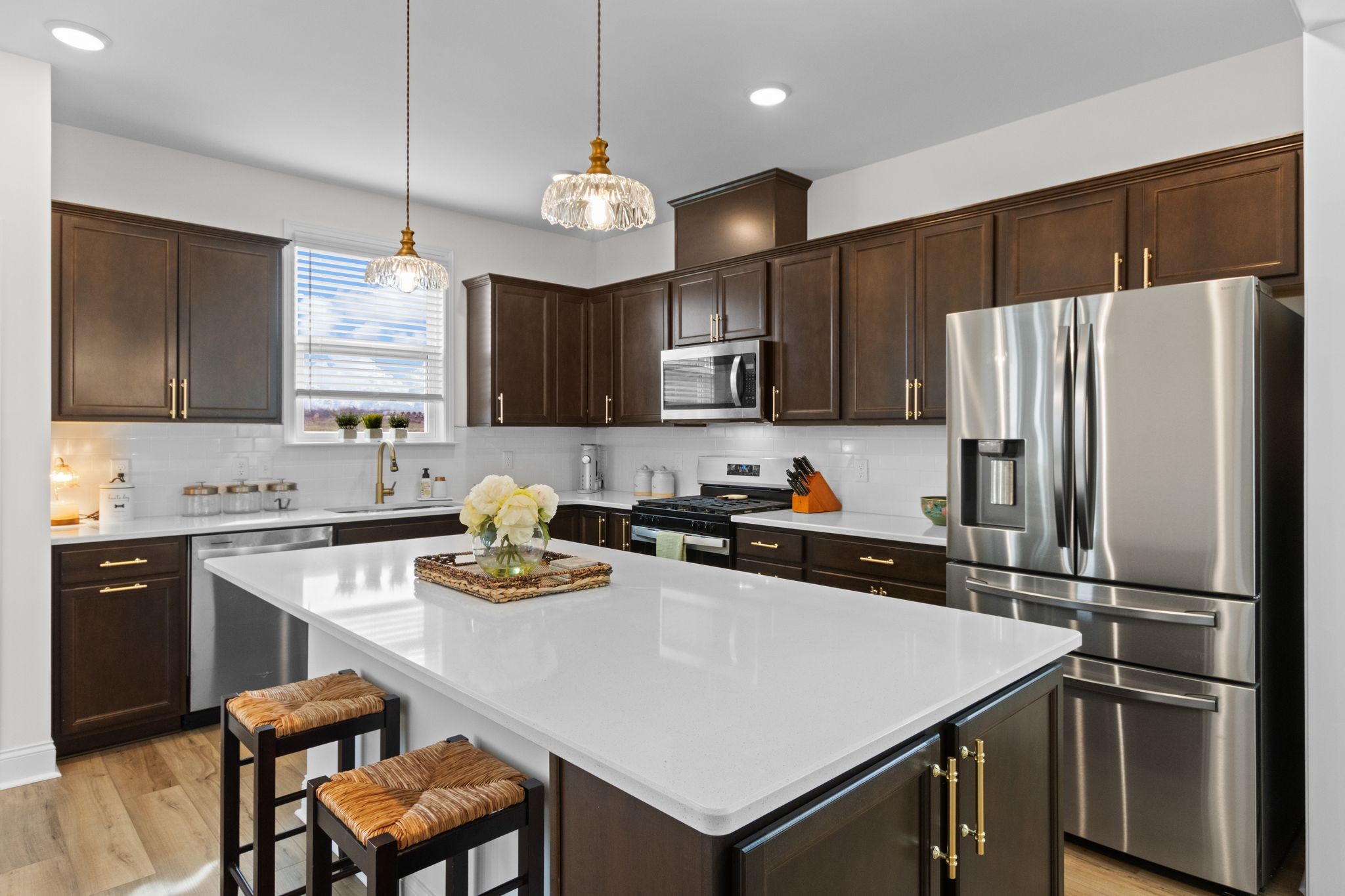 7153 Triad Way Murfreesboro, TN 37128 - Photo 14 of 35 a kitchen with stainless steel appliances a stove a sink a refrigerator and a center island