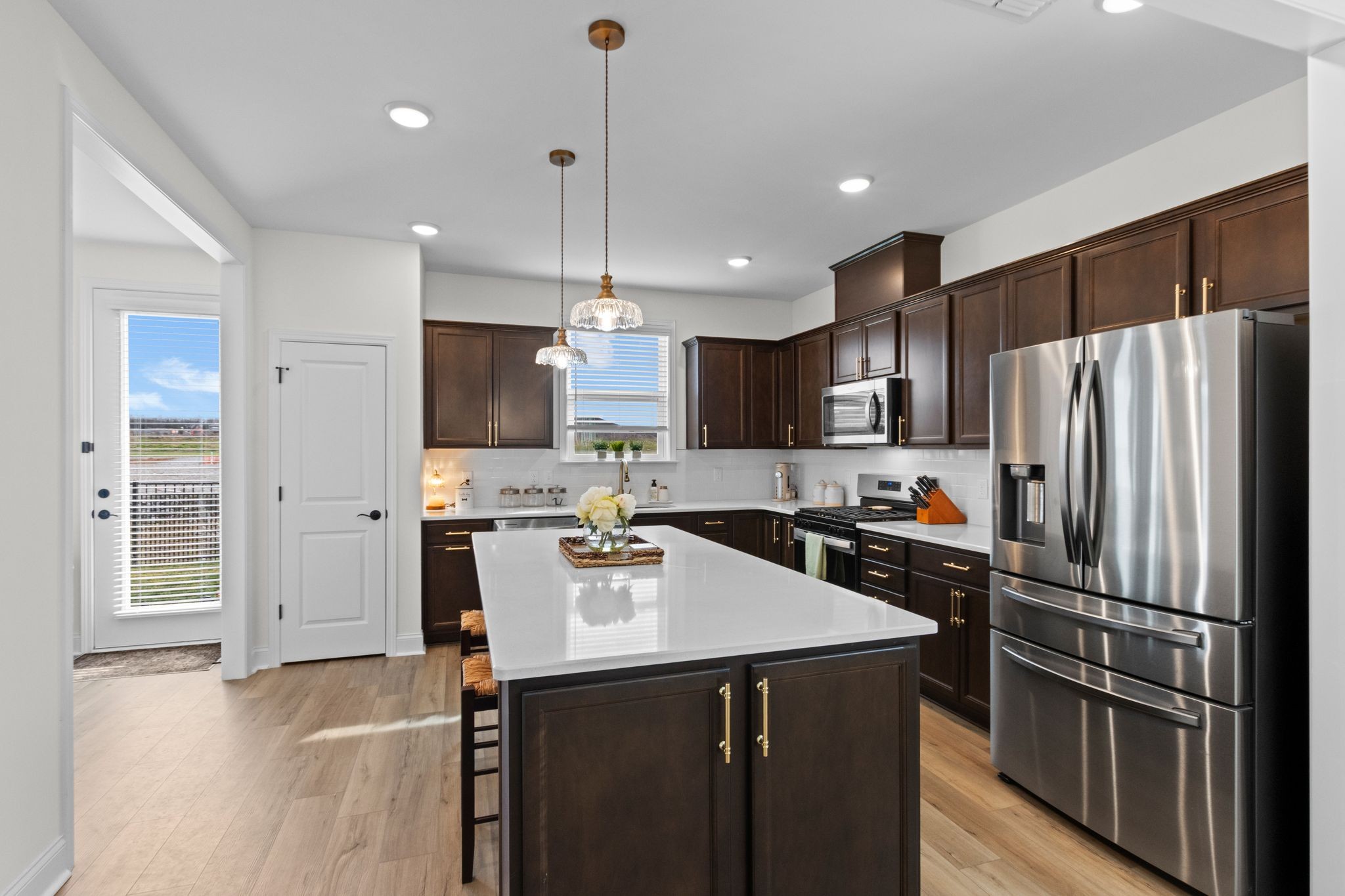 7153 Triad Way Murfreesboro, TN 37128 - Photo 15 of 35 a kitchen with kitchen island a refrigerator a sink dishwasher with a stove and refrigerator