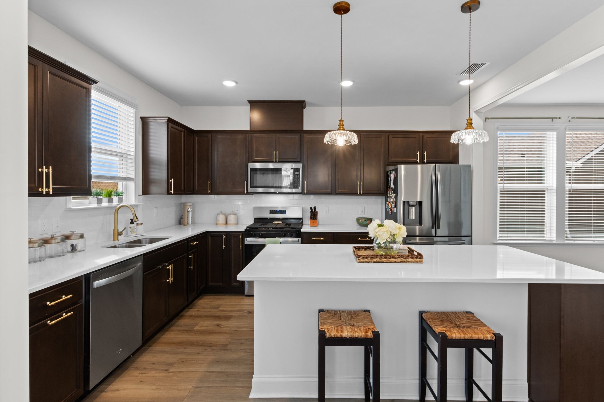 7153 Triad Way Murfreesboro, TN 37128 - Photo 16 of 35 a kitchen with stainless steel appliances granite countertop a sink a stove a refrigerator a center island and a cabinets