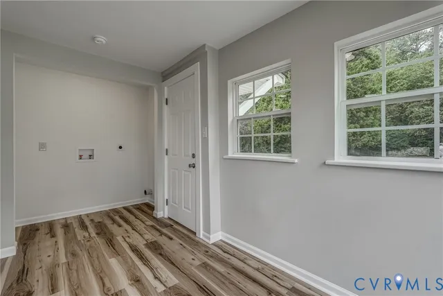 a view of room with wooden floor