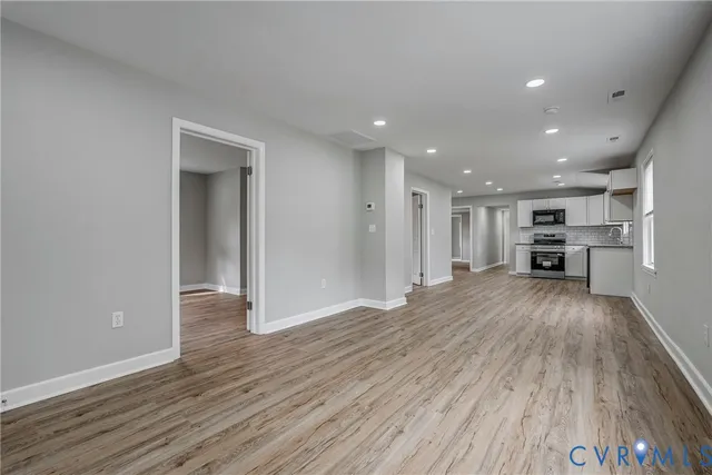 a view of kitchen with furniture and wooden floor