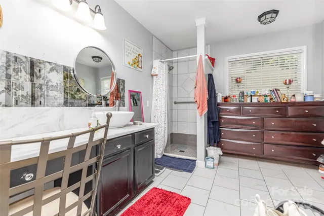 a kitchen with a wooden floor and cabinets