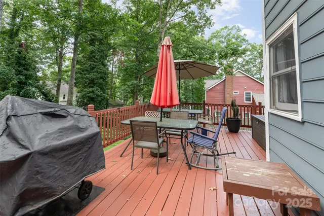 a view of a house with a patio and wooden flooring