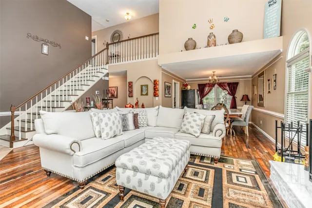 a living room with furniture and a rug
