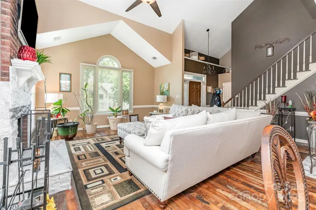 a living room with furniture fireplace and a flat screen tv