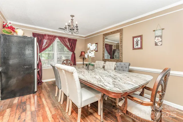 a very nice looking dining room with a table and chairs