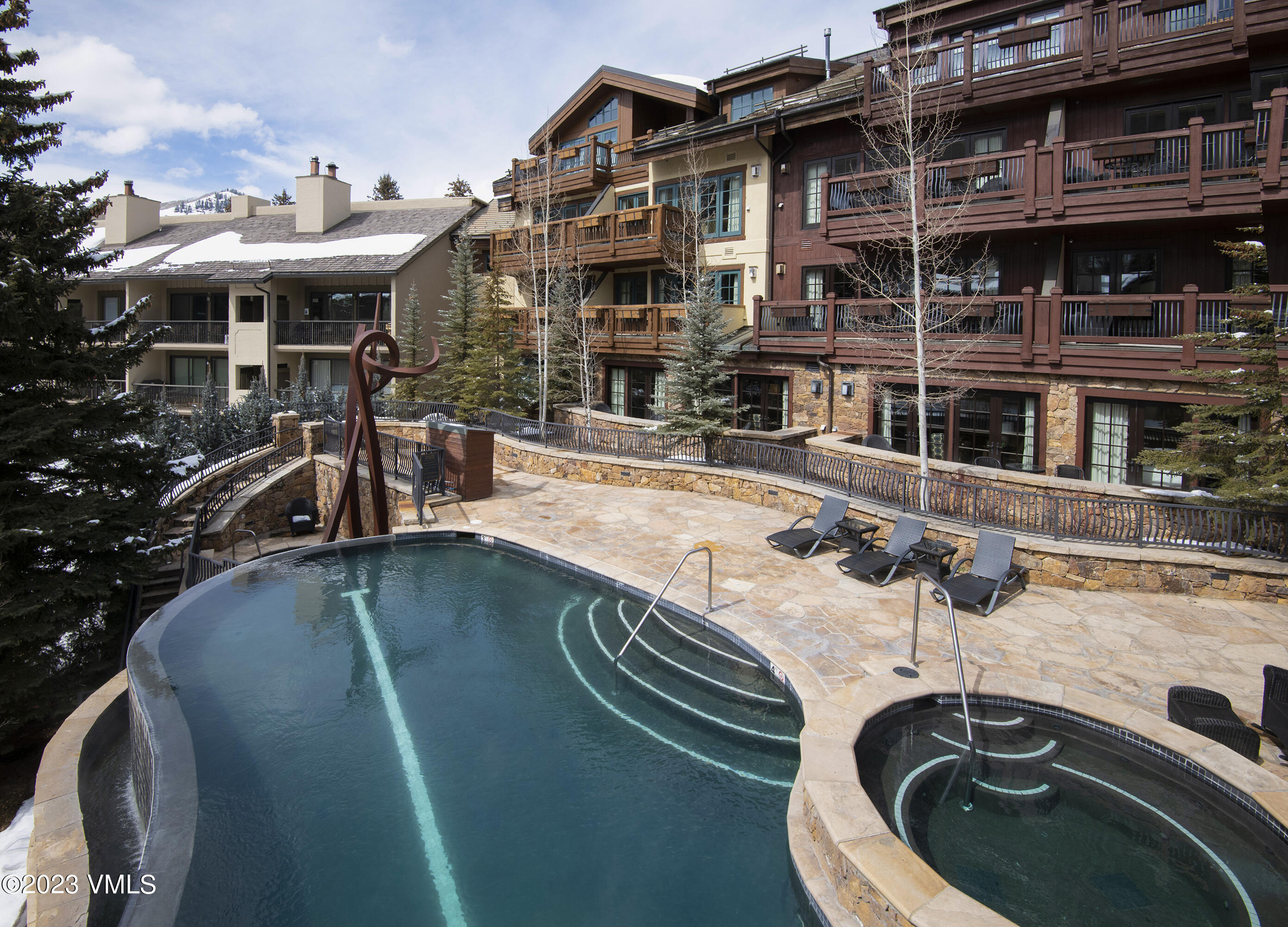 1 Willow Bridge Road, Unit 32F Vail, CO 81657 - Photo 1 of 41 a view of a patio with swimming pool