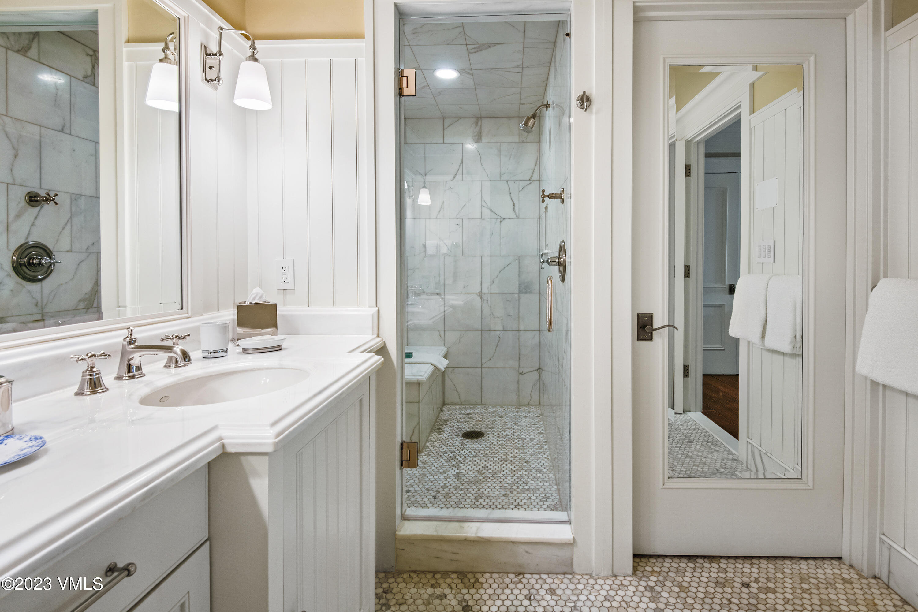 1 Willow Bridge Road, Unit 32F Vail, CO 81657 - Photo 18 of 41 a bathroom with a shower sink and mirror