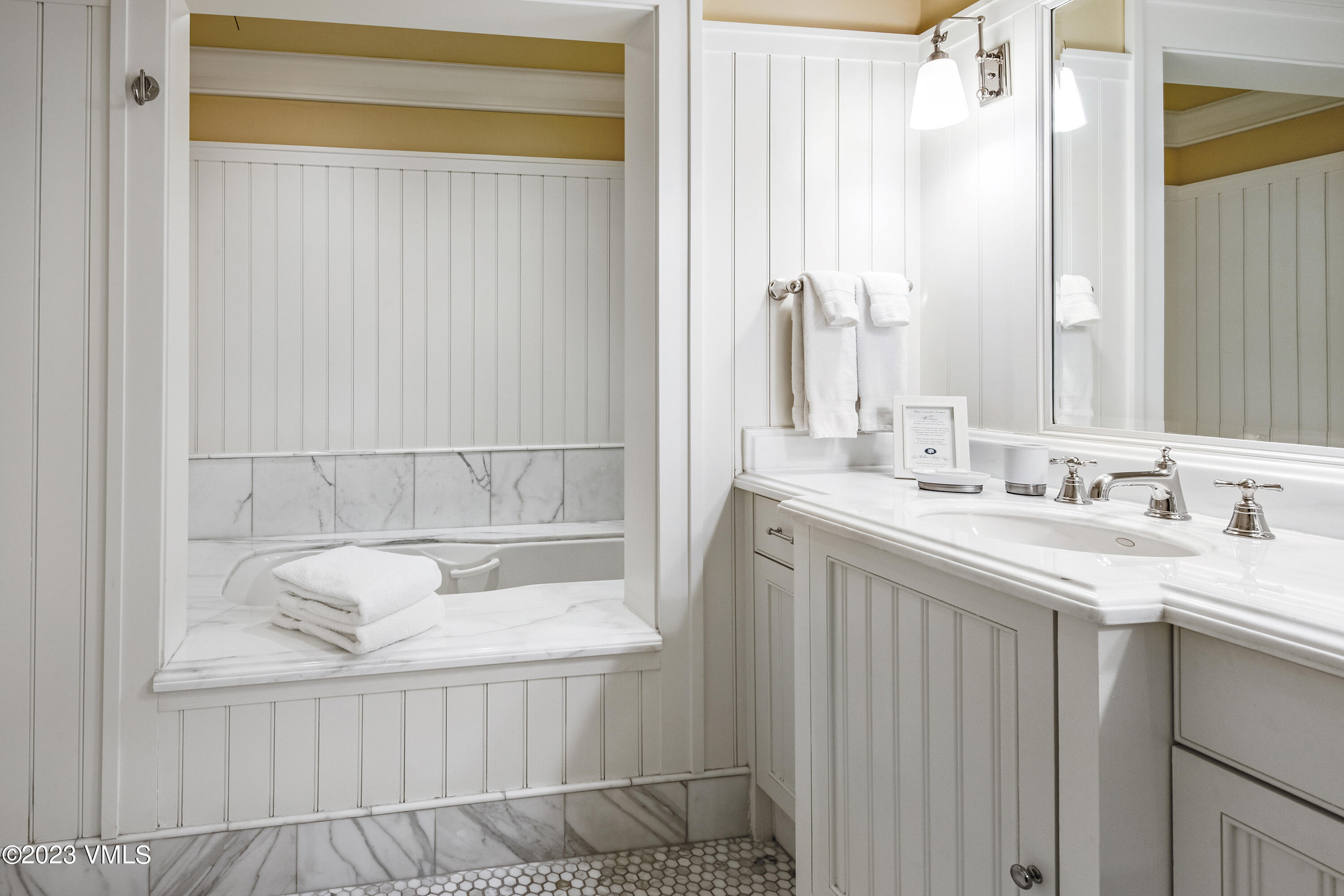 1 Willow Bridge Road, Unit 32F Vail, CO 81657 - Photo 19 of 41 a bathroom with a sink a tub and a mirror