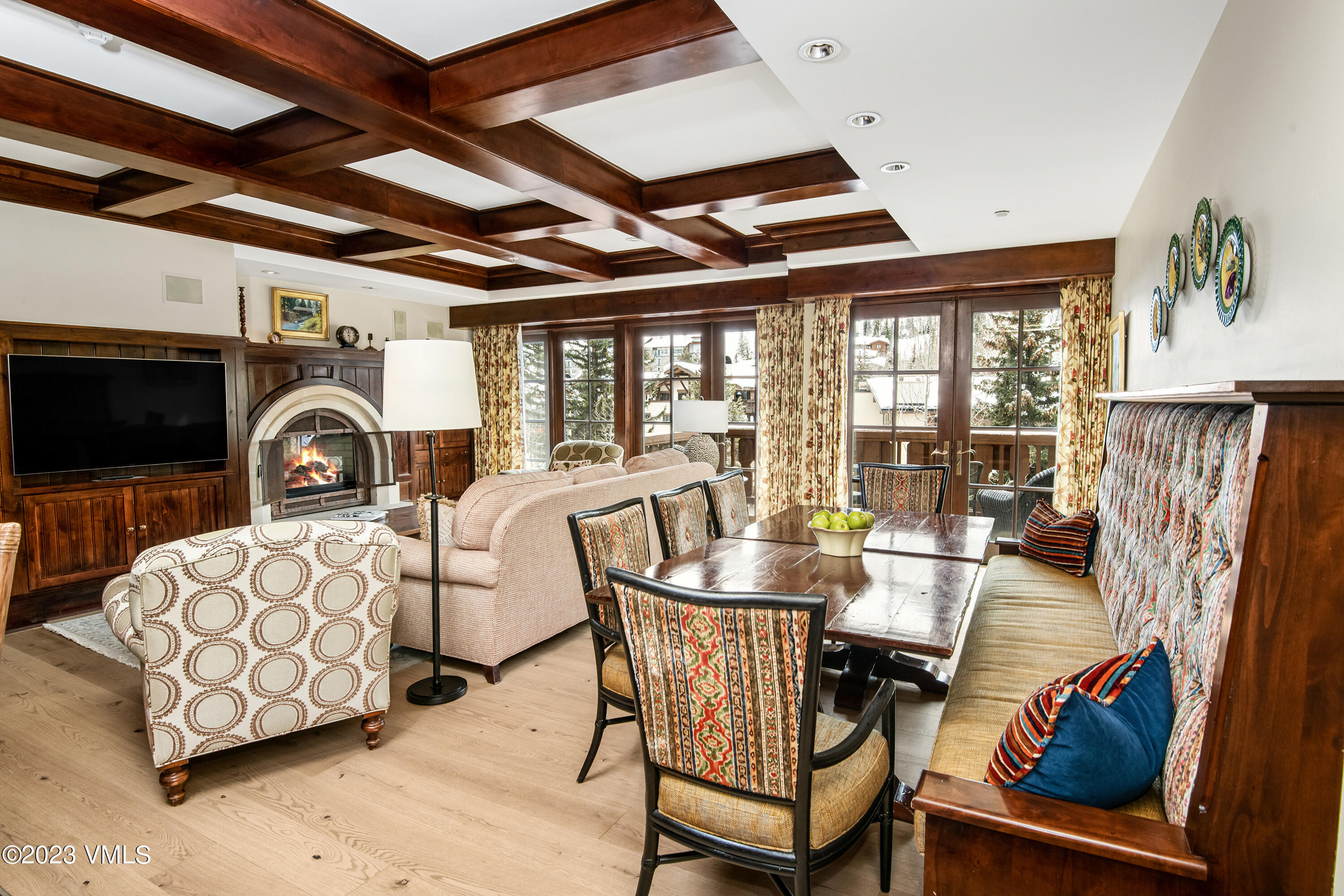 1 Willow Bridge Road, Unit 32F Vail, CO 81657 - Photo 41 of 41 a dining room with furniture a fireplace and wooden floor
