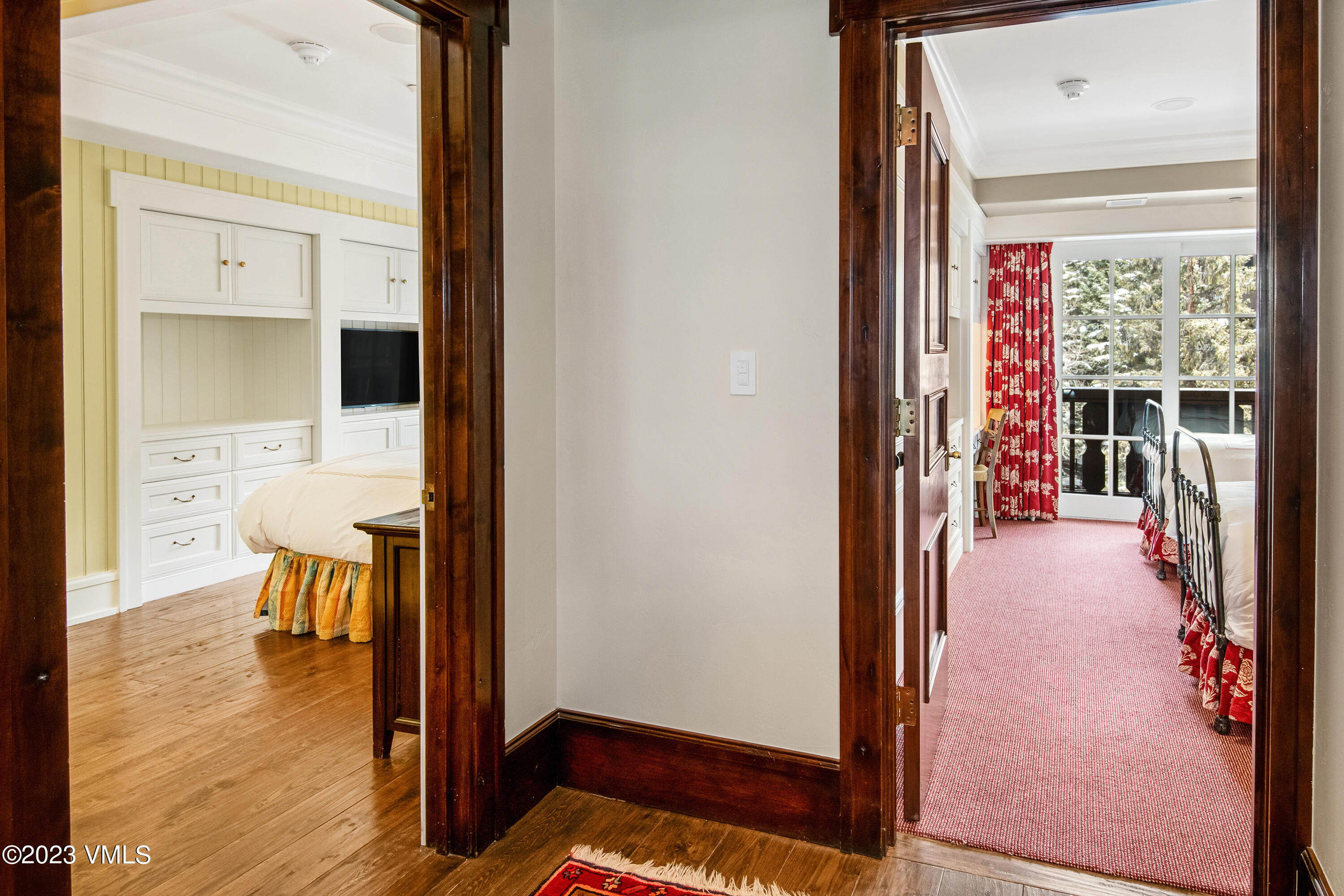 1 Willow Bridge Road, Unit 32F Vail, CO 81657 - Photo 20 of 41 a view of a hallway with wooden floor and a living room