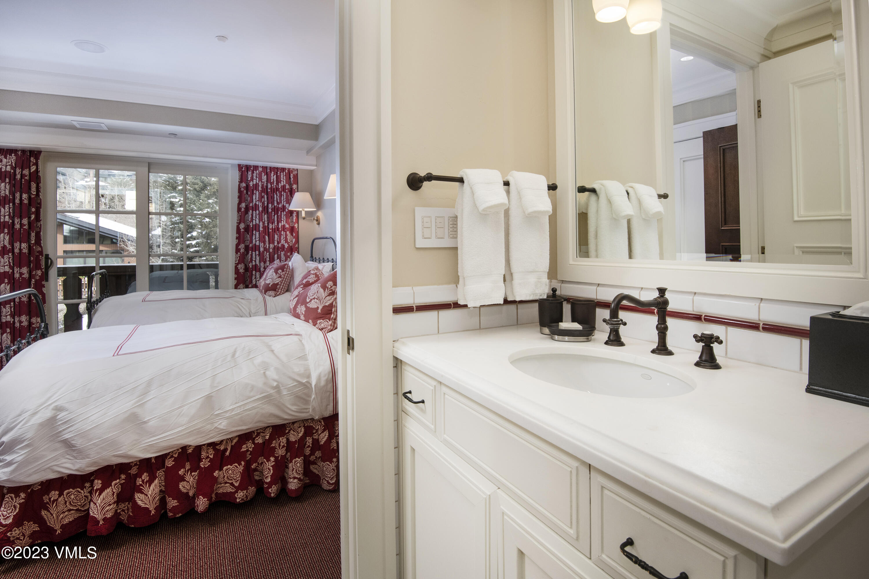 1 Willow Bridge Road, Unit 32F Vail, CO 81657 - Photo 26 of 41 a bedroom with a bed and a large white cabinet