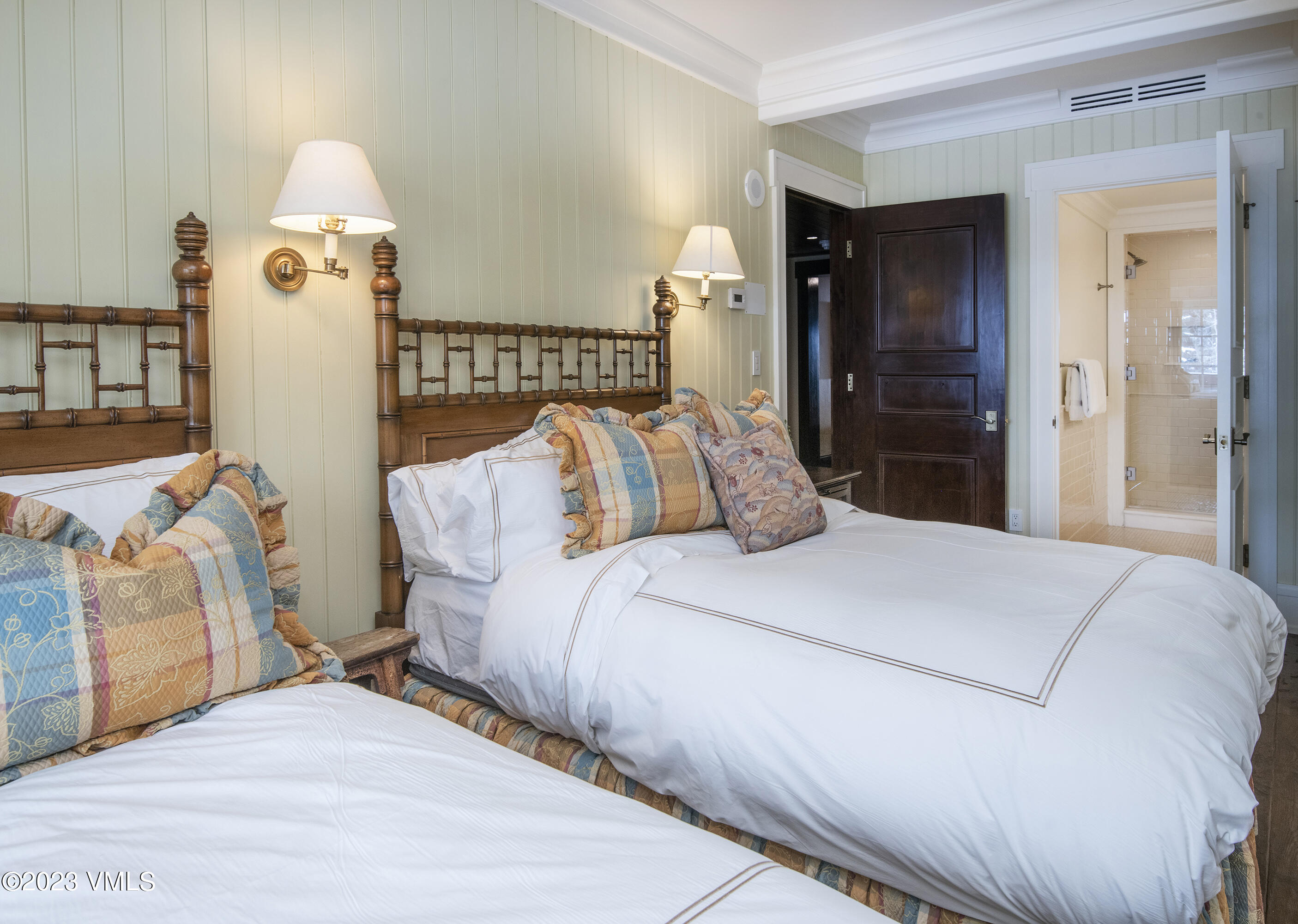 1 Willow Bridge Road, Unit 32F Vail, CO 81657 - Photo 27 of 41 a bedroom with a bed and wooden floor