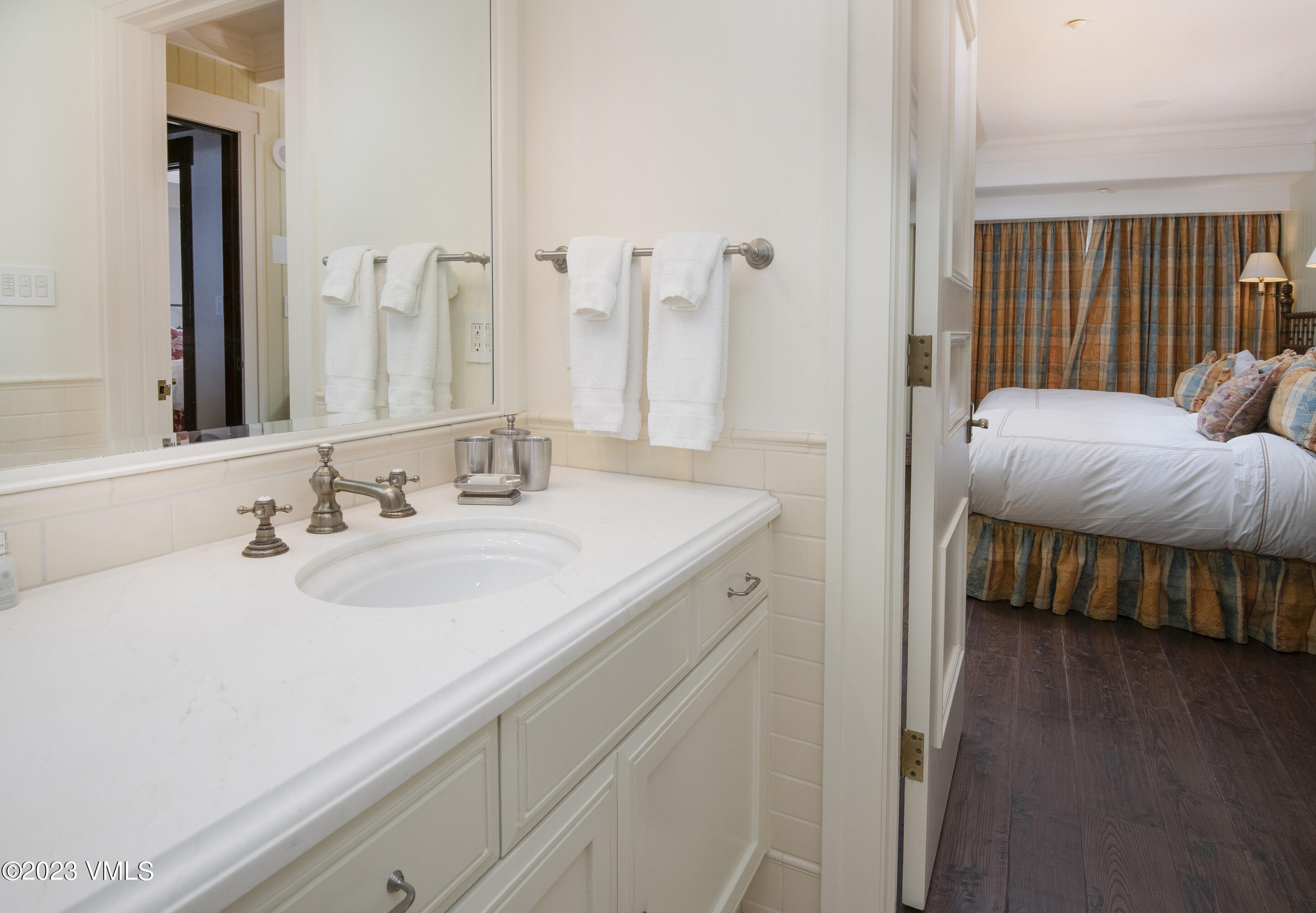 1 Willow Bridge Road, Unit 32F Vail, CO 81657 - Photo 29 of 41 a en suite bathroom with a sink and a large mirror